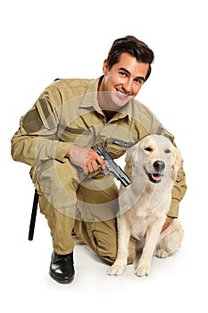 Male security guard in uniform with gun and police dog on white