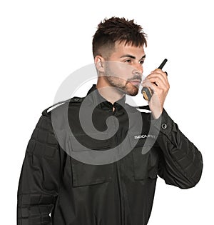 Male security guard in uniform using  radio transmitter on white background