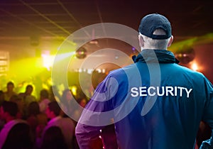 Male Security Officer Standing In Night Club