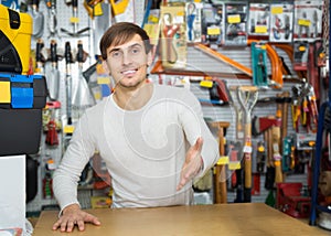 Male seller posing at tooling section