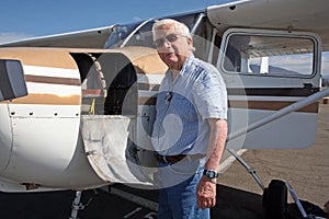 Male senior and private airplane