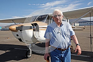 Male senior and private airplane photo