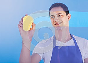 Male Servant Cleaning Glass With Sponge