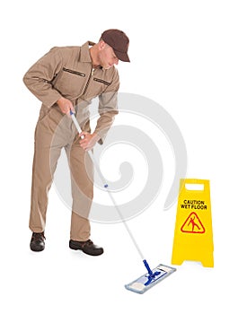 Male Servant Mopping Floor Over White Background