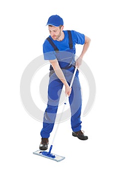 Male servant mopping floor over white background