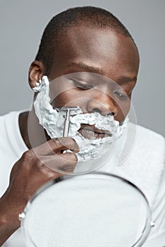 Male Shaving. Face Skincare Beauty Concept. Man Removes Facial Hair. Using Of Razor Shaver.