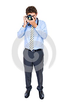 Male in shirt and tie takes photo with dslr camera