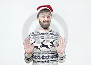 Male shows refusal gesture, does not want to participate in christmas party