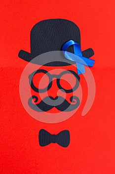 Male silhouette pattern with blue ribbon symbol. Movember concept.