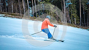 Male skier going down a slope