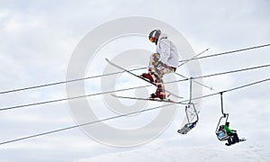 Male skier jumping in the air at ski resort.