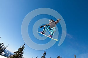 Male Snowboarder Catches Big Air. photo