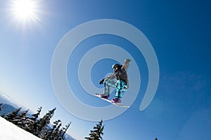 Male Snowboarder Catches Big Air. photo