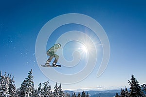 Male Snowboarder Catches Big Air. photo