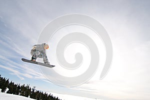 Male Snowboarder Catches Big Air. photo
