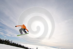 Male Snowboarder Catches Big Air. photo