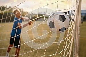 Male soccer goalkeeper missed the ball