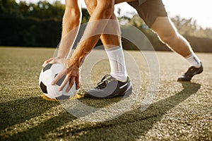 Male soccer player prepares to hits the ball