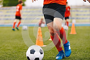 Male soccer player - slalom drills training. Football practice session