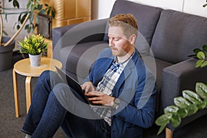 Male software developer working using laptop computer