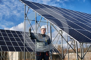 Male solar installer giving thumbs up and smiling.