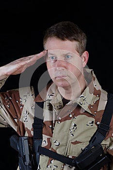 Male Soldier saluting while under arms