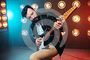 Male solo musican with electro guitar