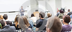 Man giving presentation in lecture hall at university.