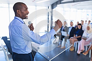 Male speaker speaks in business seminar photo