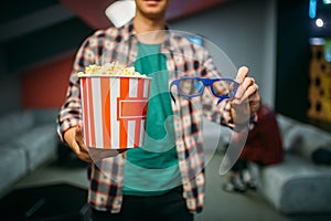 Male spectator with 3d glasses and popcorn, cinema