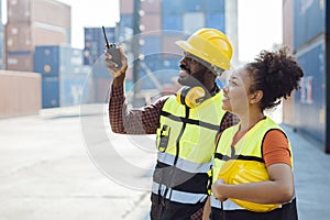 Male staff worker working together  with women team in shipping cargo port