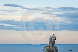 Male statue from the belvedere, the so-called Terrazza dell`infinito, The Terrace of Infinity seen on the sunset, Villa Cimbrone, photo