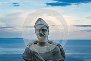 Male statue from the belvedere, the so-called Terrazza dell`infinito, The Terrace of Infinity seen on the sunset, Villa Cimbrone, photo