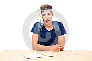 Male student with book strapped to his head