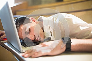 Male student falling asleep during class photo