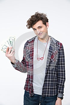 Male student standing with bills of dollars