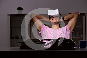 The male student with virtual glasses late at home