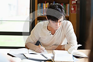 Male student working on an essay