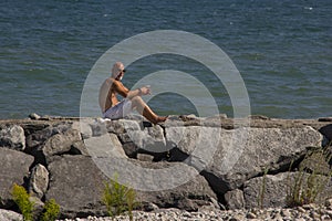 Sunbather on boulders