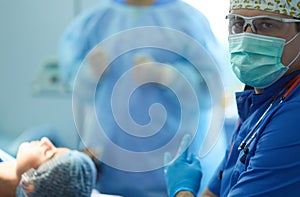 Male surgeon on background in operation room