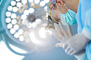 Male surgeon on background in operation room