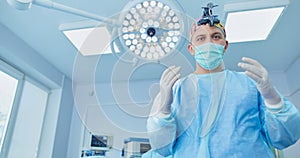 Male surgeon on background in operation room