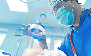 Male surgeon on background in operation room