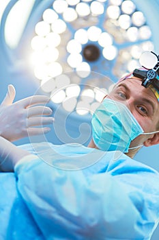 Male surgeon on background in operation room