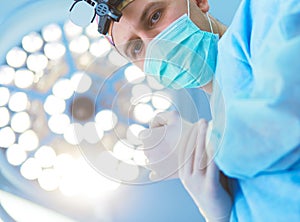 Male surgeon on background in operation room