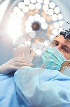 Male surgeon on background in operation room