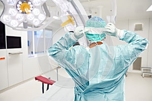 Male surgeon doctor in protective wear at surgery