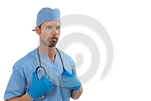 Male surgeon holding stethoscope against white background