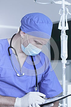 Male surgeon in protective uniform