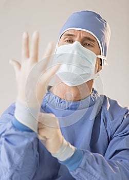 Male Surgeon Wearing Protective Glove